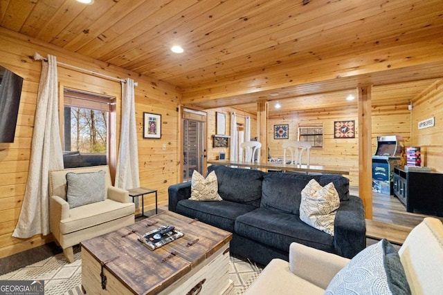 living room with wooden walls, wooden ceiling, and light wood-type flooring