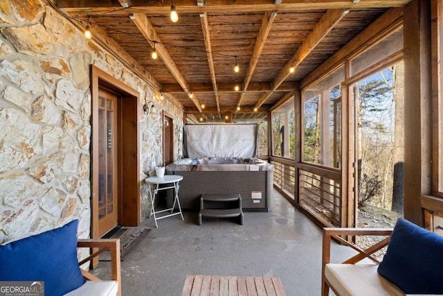 unfurnished sunroom featuring wood ceiling