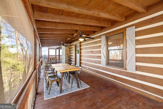 unfurnished sunroom with beam ceiling and wooden ceiling