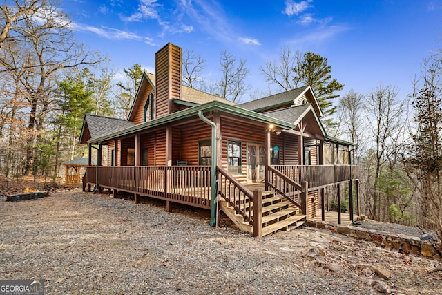 380 Oak Ridge Way, Morganton, GA 30560 - view of front facade featuring a shingled roof, faux log siding, and a chimney