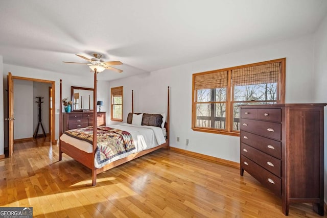 bedroom with light hardwood / wood-style floors and ceiling fan