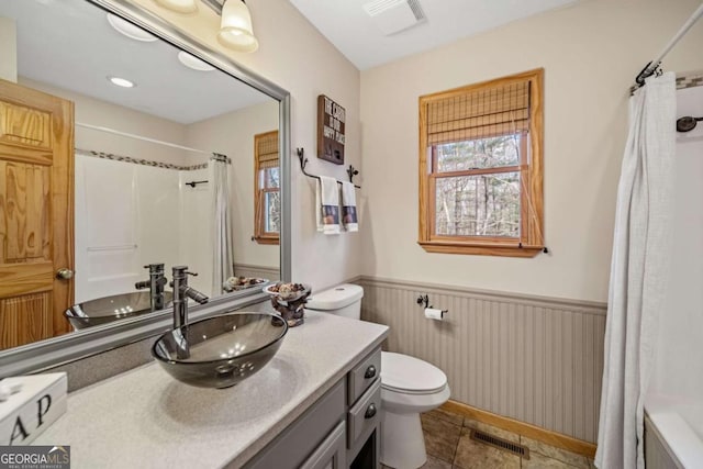 bathroom with vanity, toilet, and a shower with shower curtain