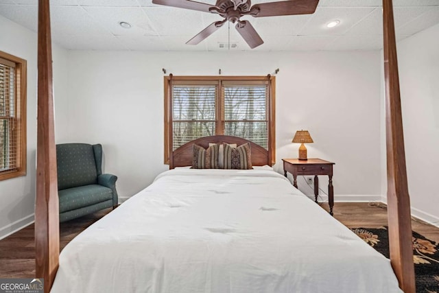 bedroom featuring ceiling fan and dark hardwood / wood-style flooring