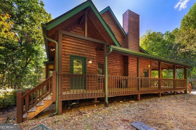 view of front of property with a wooden deck