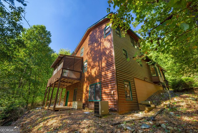 380 Oak Ridge Way, Morganton, GA 30560 - view of home's exterior with cooling unit, log veneer siding, and a wooden deck