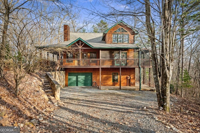 view of front of house featuring a wooden deck and a garage