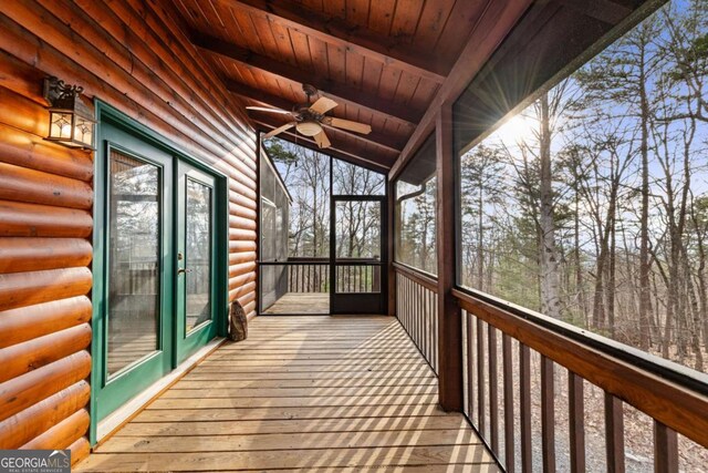 log home featuring a porch