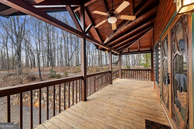 wooden terrace featuring ceiling fan