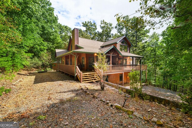 380 Oak Ridge Way, Morganton, GA 30560 - view of home's exterior with a chimney, roof with shingles, faux log siding, and a deck