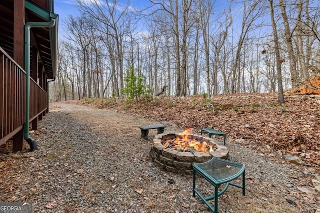 view of yard featuring a fire pit