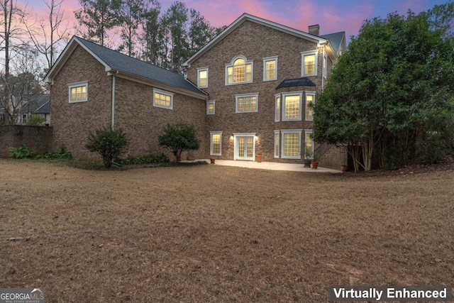 256 Allie Dr, Mcdonough, GA 30252 - rear view of house featuring french doors, brick siding, and a patio area