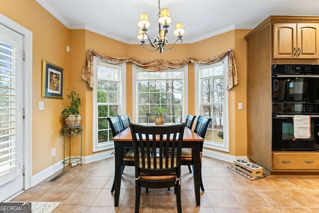 256 Allie Dr, Mcdonough, GA 30252 - dining space with ornamental molding, a notable chandelier, and baseboards