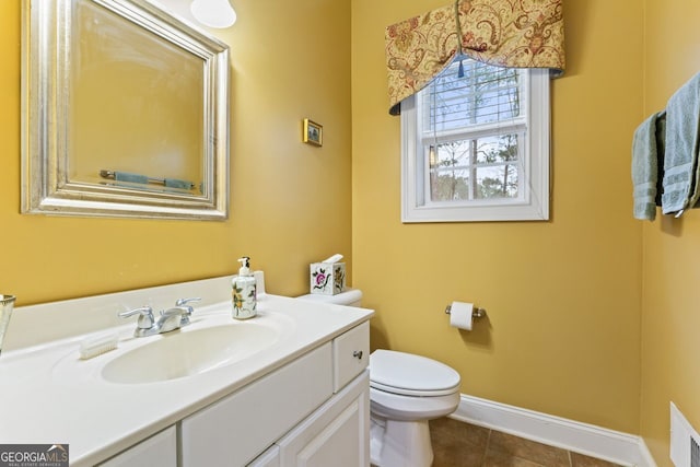 256 Allie Dr, Mcdonough, GA 30252 - bathroom featuring tile patterned floors, toilet, baseboards, and vanity