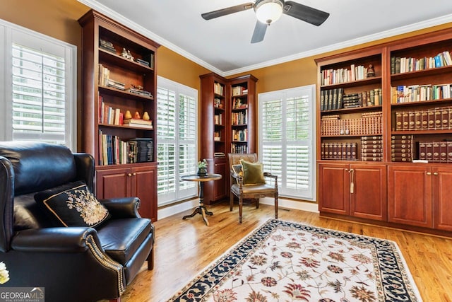 256 Allie Dr, Mcdonough, GA 30252 - living area featuring crown molding, light wood-style flooring, and a ceiling fan