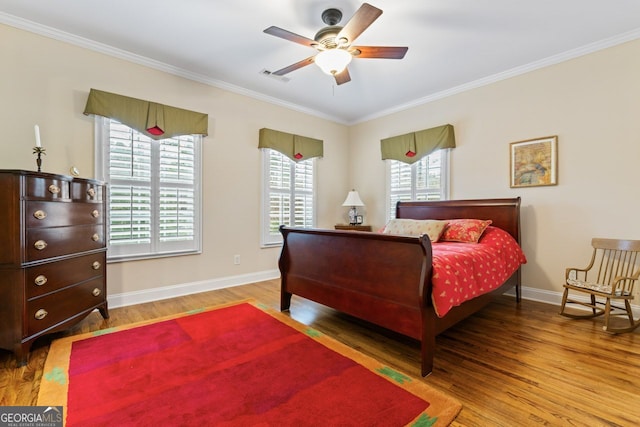 256 Allie Dr, Mcdonough, GA 30252 - bedroom with baseboards, visible vents, crown molding, and wood finished floors