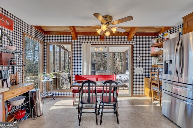 kitchen featuring wallpapered walls, ceiling fan, beam ceiling, and stainless steel fridge with ice dispenser