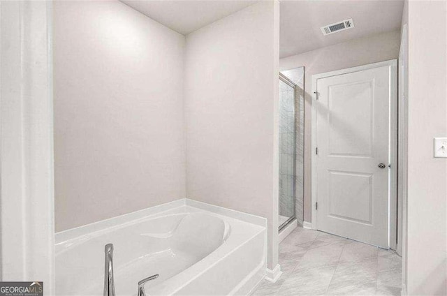 full bathroom with a stall shower, visible vents, and a garden tub