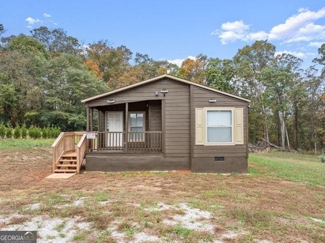 view of front facade with a porch and crawl space