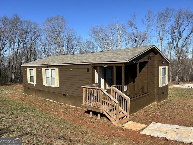 view of front of house featuring crawl space