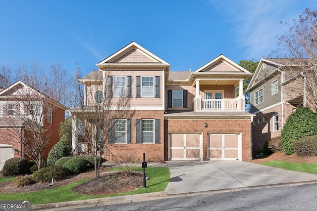 view of front of property with a balcony and a garage