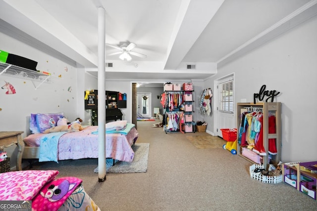 carpeted bedroom with beamed ceiling