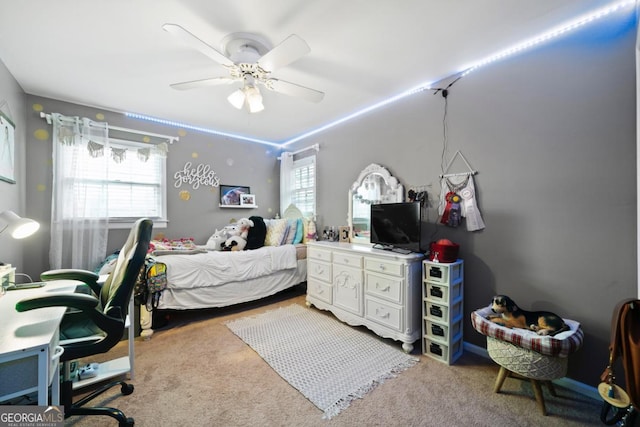carpeted bedroom with ceiling fan