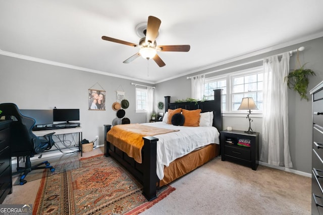carpeted bedroom with crown molding and ceiling fan