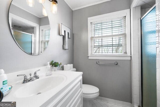 bathroom featuring ornamental molding, toilet, tile patterned flooring, and a shower with door