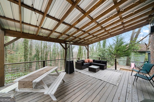 wooden deck featuring an outdoor hangout area