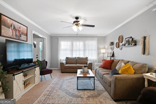 carpeted living room featuring crown molding and ceiling fan