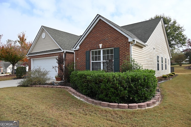 view of front facade with a garage and a front lawn