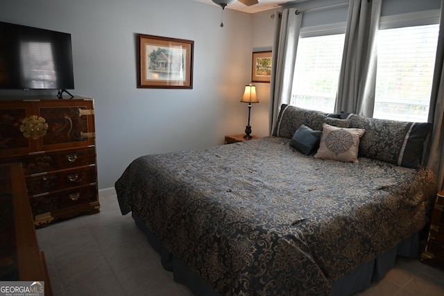 bedroom featuring light tile patterned flooring