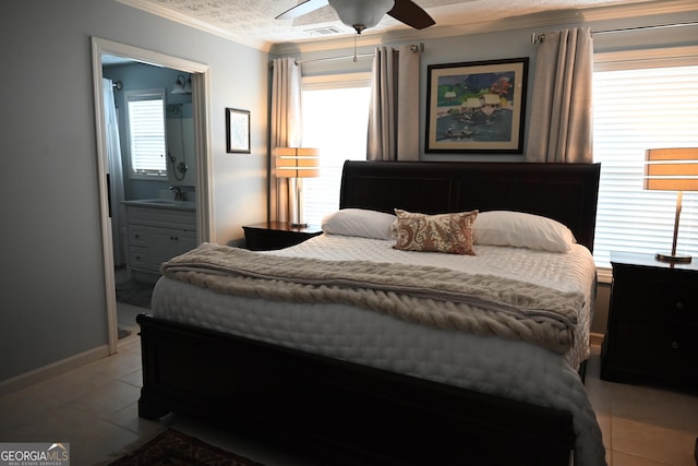 tiled bedroom featuring crown molding, ensuite bath, ceiling fan, and multiple windows