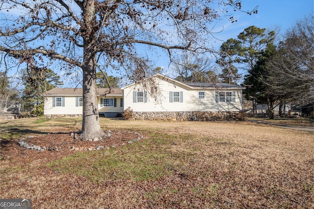 ranch-style house with a front lawn