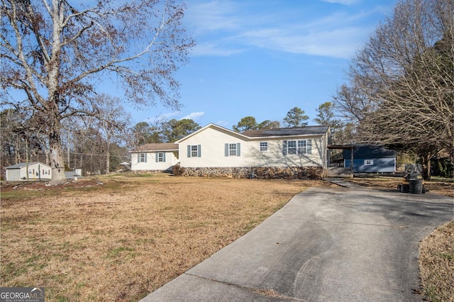 ranch-style house with a front lawn