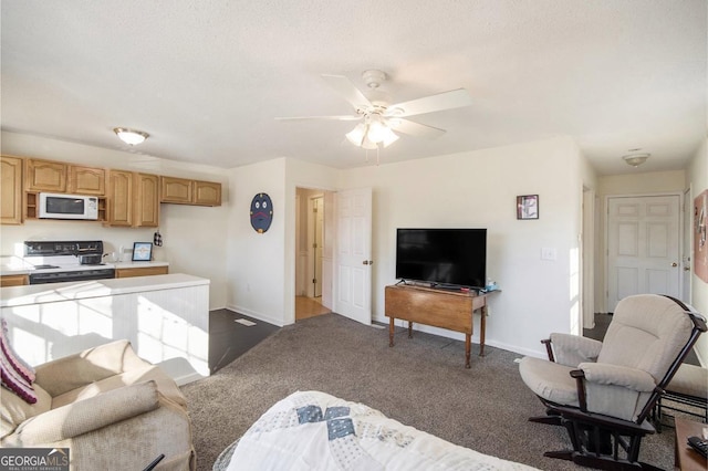 living room with ceiling fan, dark carpet, and a textured ceiling