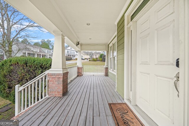 wooden terrace featuring a porch