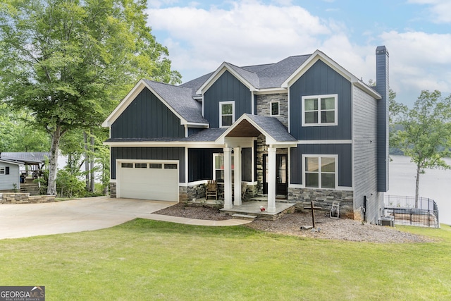 craftsman house with a front yard and covered porch