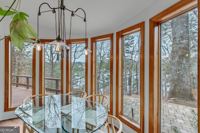 unfurnished sunroom featuring a healthy amount of sunlight