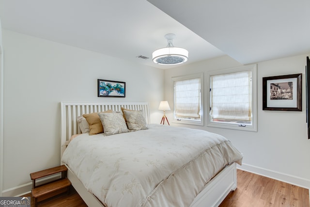 bedroom with hardwood / wood-style floors