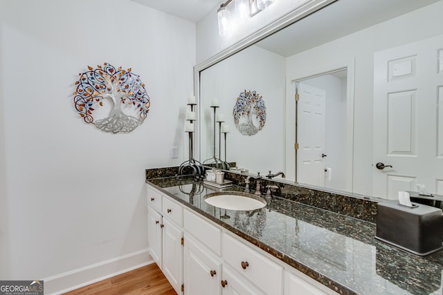 bathroom featuring vanity and hardwood / wood-style flooring