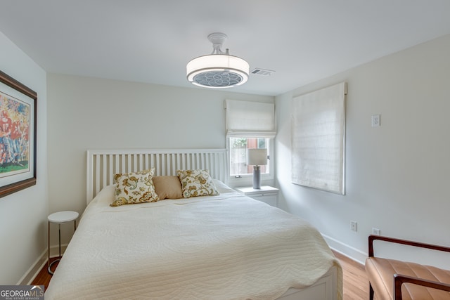 bedroom with light hardwood / wood-style floors