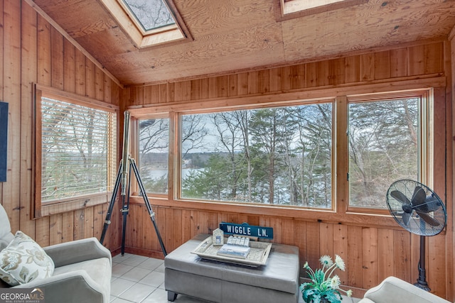 sunroom / solarium with lofted ceiling with skylight and a wealth of natural light