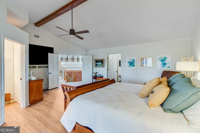 bedroom featuring lofted ceiling with beams, light hardwood / wood-style floors, and ceiling fan