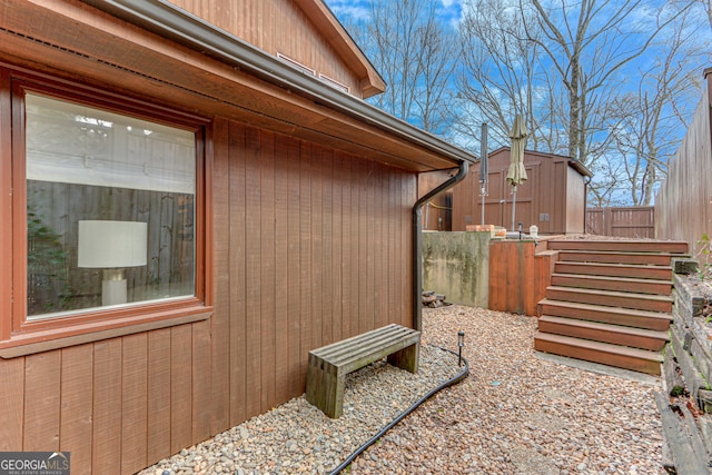 view of home's exterior with a storage shed