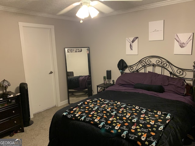 bedroom with ornamental molding, a ceiling fan, and light colored carpet