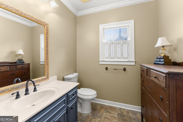 bathroom featuring crown molding, vanity, and toilet