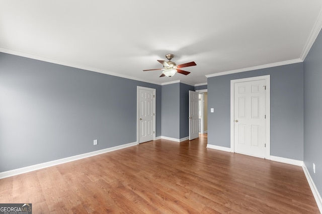 unfurnished bedroom featuring ceiling fan, ornamental molding, and hardwood / wood-style floors