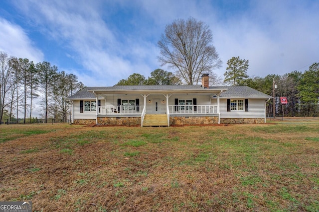 ranch-style house with a front yard and a porch