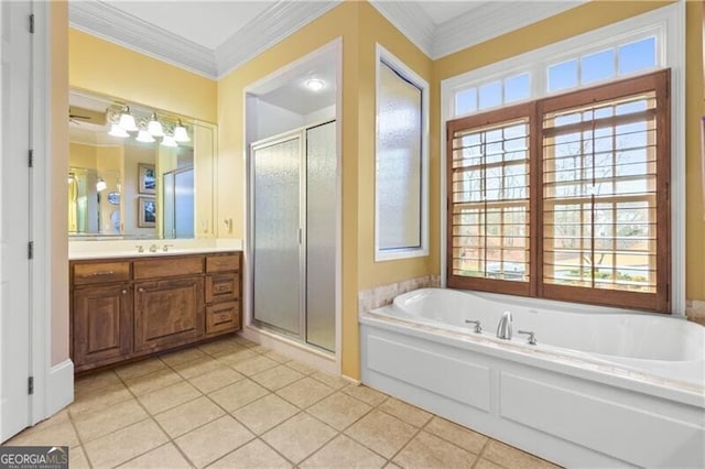 full bath featuring a shower stall, vanity, and a healthy amount of sunlight